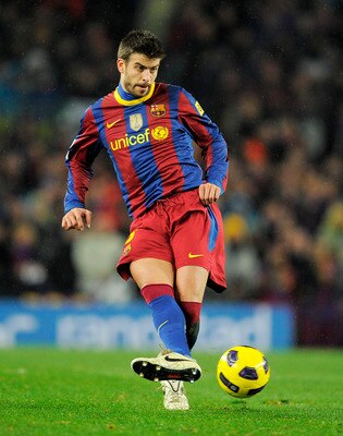 BARCELONA, SPAIN - NOVEMBER 29:  Gerard Pique of Barcelona in action during the La Liga match between Barcelona and Real Madrid at the Camp Nou Stadium on November 29, 2010 in Barcelona, Spain.  Barcelona won the match 5-0.  (Photo by David Ramos/Getty Im