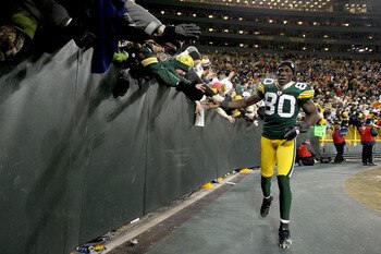 GREEN BAY, WI - JANUARY 02:  Donald Driver #80 of the Green Bay Packers circles the field after the Packers win over the Chicago Bears at Lambeau Field on January 2, 2011 in Green Bay, Wisconsin.  (Photo by Matthew Stockman/Getty Images)