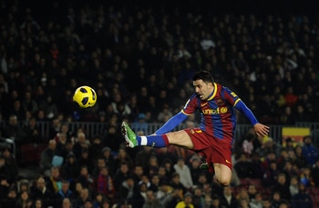 BARCELONA, SPAIN - DECEMBER 21:  David Villa of FC Barcelona jumps to control the ball during the round of last 16 Copa del Rey match between FC Barcelona and Athletic Bilbao at Camp Nou on December 21, 2010 in Barcelona, Spain. The match ended 0-0.  (Pho