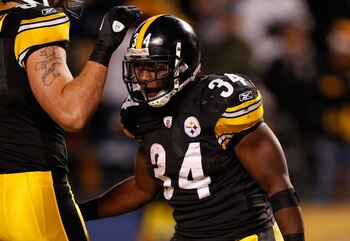 PITTSBURGH - DECEMBER 23:  Rashard Mendenhall #34 of the Pittsburgh Steelers celebrates with teammates after scoring a touchdown against the Carolina Panthers during the game on December 23, 2010 at Heinz Field in Pittsburgh, Pennsylvania.  (Photo by Jare