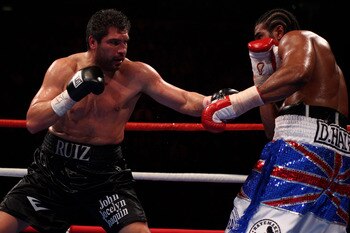 MANCHESTER, ENGLAND - APRIL 03:  John Ruiz (l) of USA hits out at David Haye (r) of England during the World Heavyweight Bout at the MEN Arena on April 3, 2010 in Manchester, England.  (Photo by Michael Steele/Getty Images)
