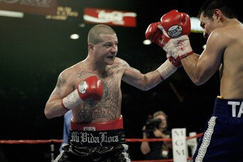 LAS VEGAS, NV - NOVEMBER 2:   Johnny Tapia defends himself against during the featherweight championship fight at the MGM Grand Garden Arena on November 2, 2002 in Las Vegas, Nevada.  (Photo by Jed Jacobsohn/Getty Images)