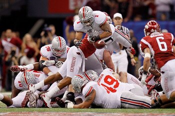 NEW ORLEANS, LA - JANUARY 04:  Dan Herron #1 of the Ohio State Buckeyes fumbles the football in the fourth quarter agianst the Arkansas Razorbacks during the Allstate Sugar Bowl at the Louisiana Superdome on January 4, 2011 in New Orleans, Louisiana.  (Ph