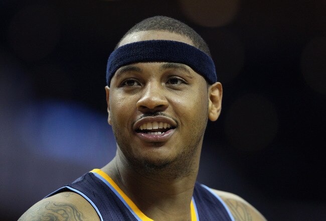 CHARLOTTE, NC - DECEMBER 07:  Carmelo Anthony #15 of the Denver Nuggets watches on against the Charlotte Bobcats during their game at Time Warner Cable Arena on December 7, 2010 in Charlotte, North Carolina.  NOTE TO USER: User expressly acknowledges and