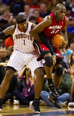 CHARLOTTE, NC - JANUARY 03: Stephen Jackson #1 of the Charlotte Bobcats battles for the ball with Joel Anthony #50 of the Miami Heat at Time Warner Cable Arena on January 3, 2011 in Charlotte, North Carolina.  The Heat defeated the Bobcats 96-82.  (Photo