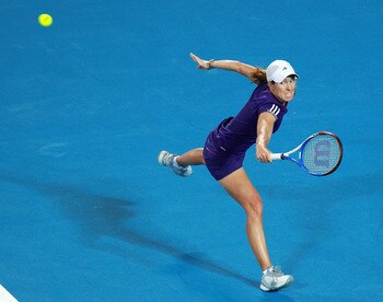 PERTH, AUSTRALIA - JANUARY 06:  Justine Henin of Belgium plays a return shot during her singles match against Ana Ivanovic of Serbia on day six of the Hopman Cup at The Burswood Dome on January 6, 2011 in Perth, Australia.  (Photo by Paul Kane/Getty Image