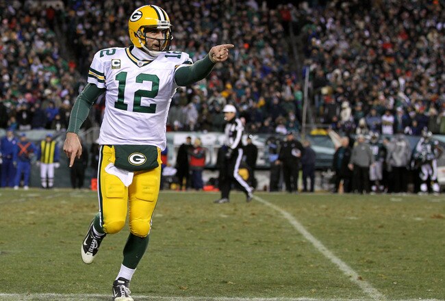 PHILADELPHIA, PA - JANUARY 09:  Aaron Rodgers #12 of the Green Bay Packers celebrates after a touchdown in the third quarter against the Philadelphia Eagles during the 2011 NFC wild card playoff game at Lincoln Financial Field on January 9, 2011 in Philad
