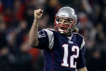 FOXBORO, MA - DECEMBER 19:  Quarterback Tom Brady #12 of the New England Patriots celebrates a touchdown scored by running back BenJarvus Green-Ellis #42 (not pictured) against the Green Bay Packers in the first quarter of the game at Gillette Stadium on