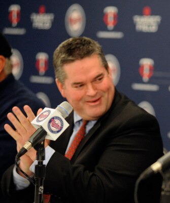 MINNEAPOLIS, MN - DECEMBER 18: General manager Bill Smith (L) of the Minnesota Twins applauds Tsuyoshi Nishioka #1 of the Minnesota Twins after Nishioka speaks a few words in english to members of the media during a press conference on December 18, 2010 a