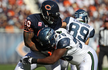 CHICAGO - OCTOBER 17: Julius Peppers #90 of the Chicago Bears rushes against Russell Okung #76 of the Seattle Seahawks at Soldier Field on October 17, 2010 in Chicago, Illinois. The Seahawks defeated the Bears 23-20. (Photo by Jonathan Daniel/Getty Images