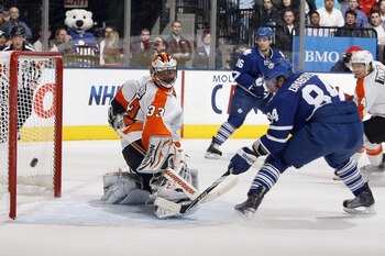 TORONTO, CANADA - DECEMBER 9: Mikhail Grabovski #84 of the Toronto Maple Leafs scores on Brian Boucher #33 of the Philadelphia Flyers during game action at the Air Canada Centre December 9, 2010 in Toronto, Ontario, Canada. (Photo by Abelimages/Getty Imag