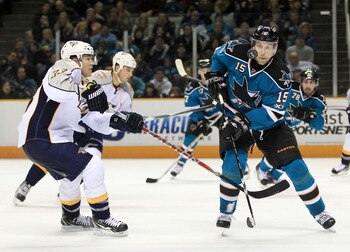 SAN JOSE, CA - JANUARY 08:  Colin Wilson #33 of the Nashville Predators and Dany Heatley #15 of the San Jose Sharks go for the puck at HP Pavilion on January 8, 2011 in San Jose, California.  (Photo by Ezra Shaw/Getty Images)