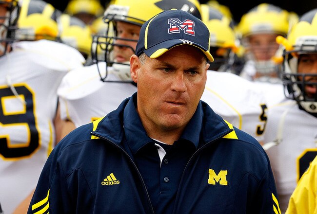 SOUTH BEND, IN - SEPTEMBER 11: Head coach Rich Rodriguez of the Michigan Wolverines waits with his team before entering the field for a game against the Notre Dame Fighting Irish at Notre Dame Stadium on September 11, 2010 in South Bend, Indiana. Michigan