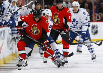 OTTAWA, ON - NOVEMBER 27:  Alex Kovalev #27 of the Ottawa Senators battles for the puck along the near boards with Mikhail Grabovski #84 of the Toronto Maple Leafs during a gam eat Scotiabank Place on November 27, 2010 in Ottawa, Ontario, Canada.  (Photo