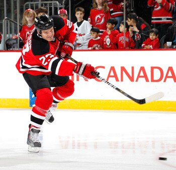 NEWARK, NJ - JANUARY 09:  David Clarkson #23 of the New Jersey Devils shoots during warmups before an NHL hockey game against the Tampa Bay Lightning at the Prudential Center on January 9, 2011 in Newark, New Jersey.  (Photo by Paul Bereswill/Getty Images