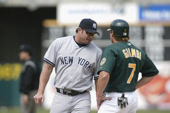 OAKLAND-APRIL 25: Jason Giambi #25 of the New York Yankees chats with brother Jeremy Giambi #7 of the Oakland A's during the game at Network Associates Coliseum in Oakland, California on April 25, 2002. The A's won 6-2. (Photo by Jed Jacobsohn/Getty Image