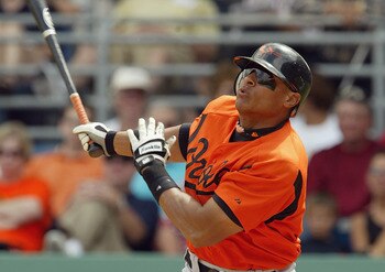 FORT MYERS, FL - MARCH 14:  First baseman David Segui #23 of the Baltimore Orioles swings during the Spring Training game against the Boston Red Sox at City of Palms Park on March 14, 2004 in Fort Myers, Florida. The Red Sox won 5-2. (Photo by Harry How/G
