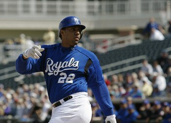 SURPRISE, AZ - MARCH 5:  Juan Gonzalez #22 of the Kansas City Royals looks back after a swing during the game against the Texas Rangers during a spring training game on March 5, 2004 at Surprise Stadium in Surprise, Arizona. The Rangers won 10-5. (Photo b
