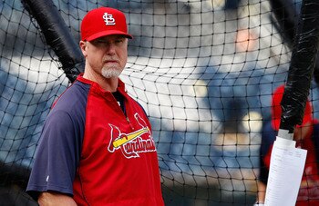 PITTSBURGH - AUGUST 25:  Hitting coach Mark McGwire #25 of the St. Louis Cardinals watches his team during batting practice before the game against the Pittsburgh Pirates on August 25, 2010 at PNC Park in Pittsburgh, Pennsylvania.  (Photo by Jared Wickerh