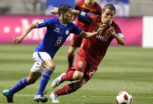 SANDY, UT - SEPTEMBER 19: Luis Gil #21 of Real Salt Lake and Javier Aquino #7 of Cruz Azul chase the ball during the first half of an CONCACAF soccer game October 19, 2010 at Rio Tinto Stadium in Sandy, Utah. (Photo by George Frey/Getty Images)