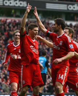 LIVERPOOL, UNITED KINGDOM - MARCH 22:  Steven Gerrard of Liverpool celebrates with his team mates after scoring his team's third goal during the Barclays Premier League match between Liverpool and Aston Villa at Anfield on March 22, 2009 in Liverpool, Eng