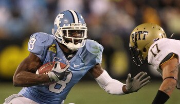 CHARLOTTE, NC - DECEMBER 26:  Aaron Berry #17 of the Pittsburgh Panthers tackles Greg Little #8 of the North Carolina Tar Heels during their game on December 26, 2009 in Charlotte, North Carolina.  (Photo by Streeter Lecka/Getty Images)