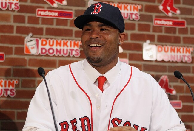 BOSTON, MA - DECEMBER 11:  Carl Crawford answers questions during a press conference announcing his signing with the Boston Red Sox on December 11,  2010 at the Fenway Park in Boston, Massachusetts.  (Photo by Elsa/Getty Images)