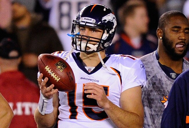 SAN DIEGO - NOVEMBER 22: Quarterback Tim Tebow #15 of the Denver Broncos tosses the footbal on the sideline during the football game against the San Diego Chargers at Qualcomm Stadium on November 22, 2010 in San Diego, California. Chargers defeated the Br
