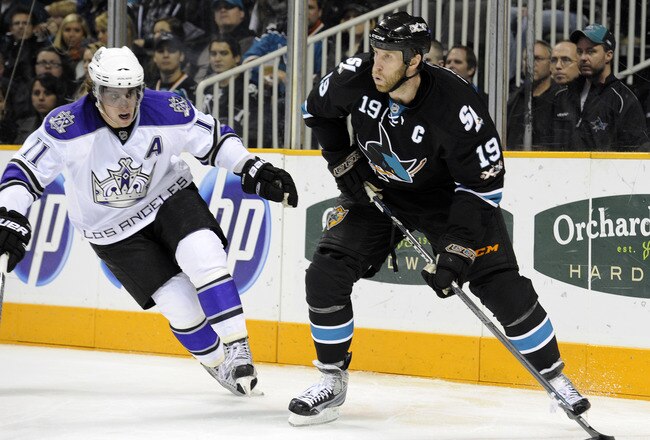 SAN JOSE, CA - DECEMBER 27:  Joe Thornton #19 of the San Jose Sharks controls the puck in front of Anze Kopitar #11 of the Los Angeles Kings during an NHL hockey game at the HP Pavilion on December 27, 2010 in San Jose, California. (Photo by Thearon W. He