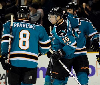 SAN JOSE, CA - JANUARY 15:  Dany Heatley #15 of the San Jose Sharks celebrates with Joe Thornton #19 and Joe Pavelski #8 after he scored a goal against the St. Louis Blues in the second period of an NHL hockey game at the HP Pavilion on January 15, 2011 i