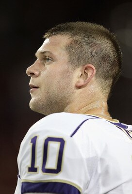 TUCSON, AZ - OCTOBER 23:  Quarterback Jake Locker #10 of the Washington Huskies watches from the sidelines during the college football game against the Arizona Wildcats at Arizona Stadium on October 23, 2010 in Tucson, Arizona.  (Photo by Christian Peters