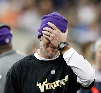 DETROIT - DECEMBER 13:  Quarterback Brett Favre #4 of the Minnesota Vikings covers his face with his hand during the game against the New York Giants at Ford Field on December 13, 2010 in Detroit, Michigan. The Giants defeated the Vikings 21-3.  (Photo by