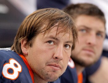 DENVER - OCTOBER 24:  Quarterbacks Kyle Orton #8 and Tim Tebow #15 of the Denver Broncos look on from the bench during their 59-14 loss to the Oakland Raiders at INVESCO Field at Mile High on October 24, 2010 in Denver, Colorado. (Photo by Justin Edmonds/