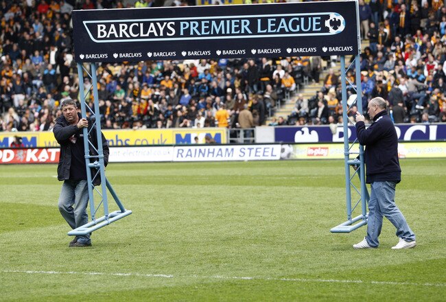 HULL, ENGLAND - MAY 9: The Barclay Premier League sign is removed from the pitch just before the start of the final premier league game at relegated Hull City's KC stadium during the Barclays Premier League match between Hull City and Liverpool at the KC