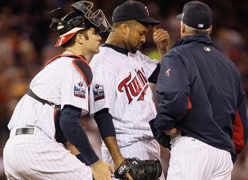 MINNEAPOLIS - OCTOBER 06:  Starting pitcher Francisco Liriano #47 of the Minnesota Twins talks with Joe Mauer #7 and pitching coach Rick Anderson in the sixth inning against the New York Yankees during game one of the ALDS on October 6, 2010 at Target Fie