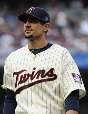 MINNEAPOLIS, MN - APRIL 12: Carl Pavano #48 of the Minnesota Twins returns the dugout in the middle of the fifth inning against the Boston Red Sox during the Twins home opener at Target Field on April 12, 2010 in Minneapolis, Minnesota. (Photo by Hannah F
