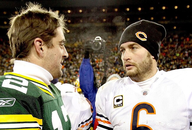 GREEN BAY, WI - JANUARY 02:  Quarterback Aaron Rodgers #12 of the Green Bay Packers is congratukated by quarterback Jay Cutler #6 of the Chicago Bears at Lambeau Field on January 2, 2011 in Green Bay, Wisconsin.  (Photo by Matthew Stockman/Getty Images)