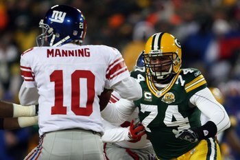GREEN BAY, WI - JANUARY 20:  Defensive end Aaron Kampman #74 of the Green Bay Packers rushes in at Eli Manning #10 of the New York Giants during the NFC championship game on January 20, 2008 at Lambeau Field in Green Bay, Wisconsin. The Giants defeated th