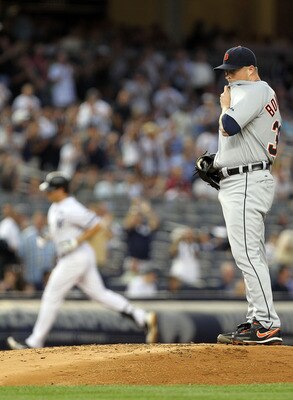 NEW YORK - AUGUST 18:  Jeremy Bonderman #38 of the Detroit Tigers wipes his face as Mark Teixeira #25 of the New York Yankees rounds the bases at Yankee Stadium on August 18, 2010 in the Bronx borough of New York City.  (Photo by Nick Laham/Getty Images)