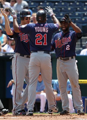 KANSAS CITY, MO - JULY 28:  Delmon Young #21 of the Minnesota Twins is congratulated by Joe Mauer #7 and Denard Span #2 after hitting a 3-run home run during the 1st inning of the game against the Kansas City Royals on July 28, 2010 at Kauffman Stadium in