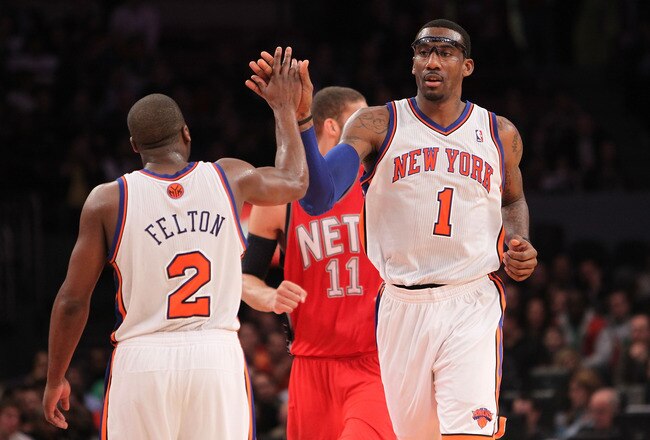 NEW YORK, NY - NOVEMBER 30:  Amar'e Stoudemire #1 of the New York Knicks high fives teammate Raymond Felton #2l against the New Jersey Nets on November 30, 2010 at Madison Square Garden in New York City. NOTE TO USER: User expressly acknowledges and agree