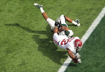 ORLANDO, FL - JANUARY 01:  Mark Ingram #22 of the Alabama Crimson Tide scores a touchdown during the Capitol One Bowl against the Michigan State Spartans at the Florida Citrus Bowl on January 1, 2011 in Orlando, Florida.  (Photo by Mike Ehrmann/Getty Imag