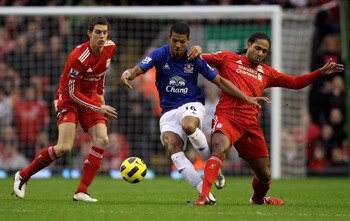 Daniel Agger and Glen Johnson of Liverpool and Jermaine Beckford of Everton