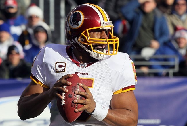 EAST RUTHERFORD, NJ - DECEMBER 05:  Donovan McNabb #5 of the Washington Redskins looks to throw a pass against the New York Giants on December 5, 2010 at the New Meadowlands Stadium in East Rutherford, New Jersey. The Giants defeated the Redskins 31-7.  (