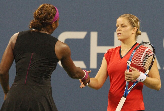 NEW YORK - SEPTEMBER 12:  Kim Clijsters of Belgium (R) was congratulated by Serena Williams after Williams was disqualified for a conduct violation towards a line judge during the Women's Singles Semifinal match on day thirteen of the 2009 U.S. Open at th