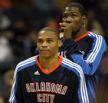 CHARLOTTE, NC - DECEMBER 21:  Teammates Kevin Durant #35 and Russell Westbrook #0 of the Oklahoma Thunder warmup before the start of their game against the Charlotte Bobcats at Time Warner Cable Arena on December 21, 2010 in Charlotte, North Carolina. NOT