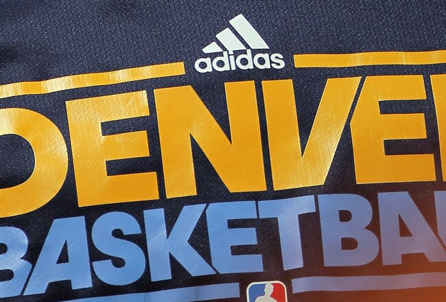 DENVER, CO - JANUARY 21:  Carmelo Anthony #15 of the Denver Nuggets looks on as he warms up for the second half against the Los Angeles Lakers at the Pepsi Center on January 21, 2011 in Denver, Colorado. The Lakers defeated the Nuggets 107-97. NOTE TO USE