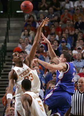 DALLAS - MARCH 12:  Sasha Kaun #24 of the Kansas Jayhawks shoots against LaMarcus Aldridge #23 of the Texas Longhorns during the final of the Phillips 66 Big 12 Men's Basketball Championship Tournament at American Airlines Arena on March 12, 2006 in Dalla