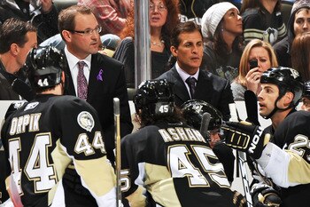 PITTSBURGH - NOVEMBER 19:  Head Coach Dan Bylsma and assistant coach Tony Granato of the Pittsburgh Penguins address the team during a timeout against the Carolina Hurricanes on November 19, 2010 at Consol Energy Center in Pittsburgh, Pennsylvania.  (Phot