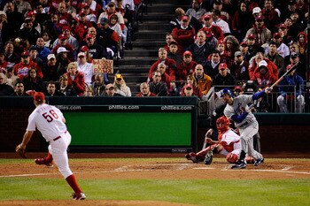 PHILADELPHIA - OCTOBER 19:  Casey Blake #23 of the Los Angeles Dodgers hits a RBI single to drive in Manny Ramirez #99 in the top of the sixth inning against Joe Blanton #56 of the Philadelphia Phillies in Game Four of the NLCS during the 2009 MLB Playoff